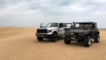 Traveling through the desert in prepared off-road vehicles